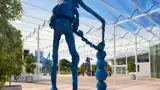 Blue sculpture in outdoor courtyard
