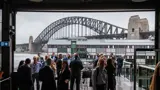 Guest at the Infrastructure Industry Forum with the Sydney Harbour Bridge in the backdrop