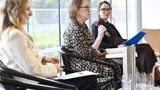 Panel of three female INSW staff members presenting at the Co:Lab event